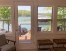Remodeled lake house interior overlooking waterfront and back porch.