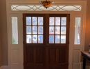 Interior remodel of porch with wooden french doors.
