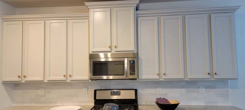 Remodeled white kitchen cabinets.